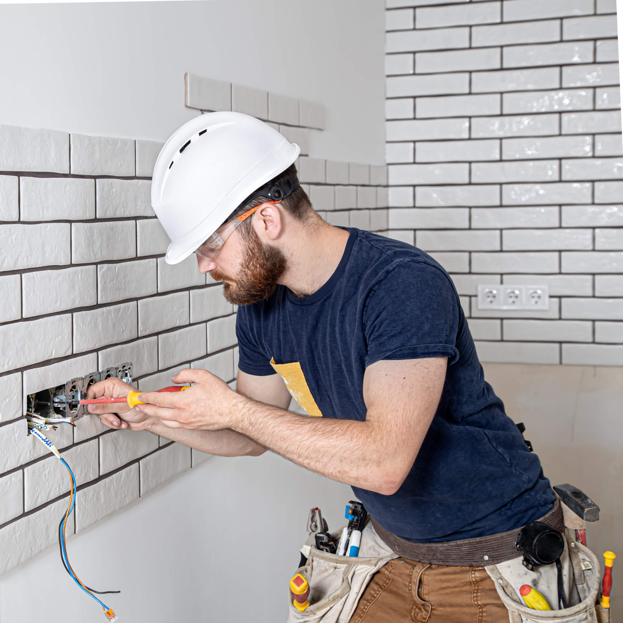 electrician-construction-worker-with-beard-overalls-during-installation-sockets-home-